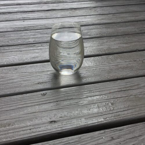 A glass of water on the ground