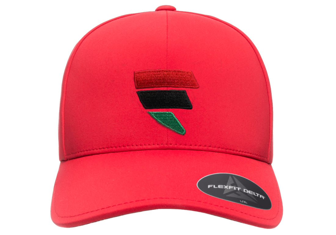 A red hat with a black and green logo on it.