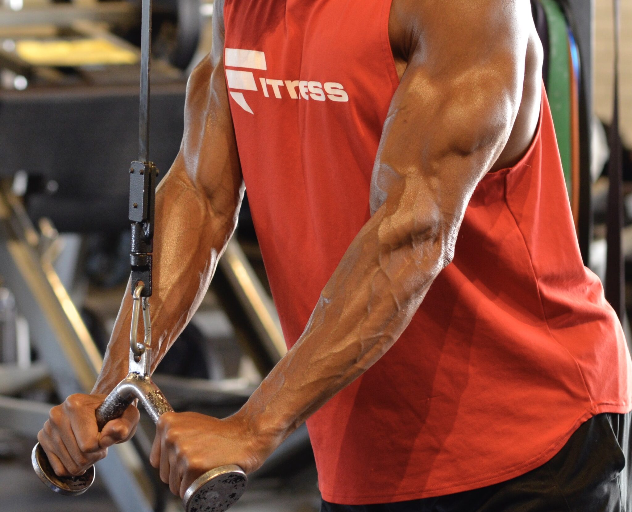 A man is working out with some kind of equipment